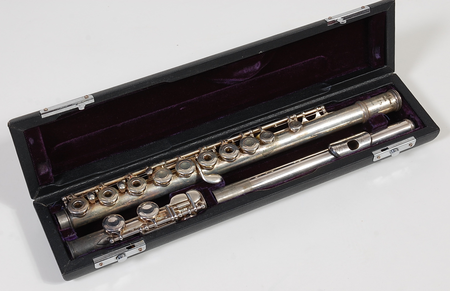 A cased silver-plated three piece flute, by Trevor J. James, T.J.