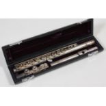 A cased silver-plated three piece flute, by Trevor J. James, T.J.