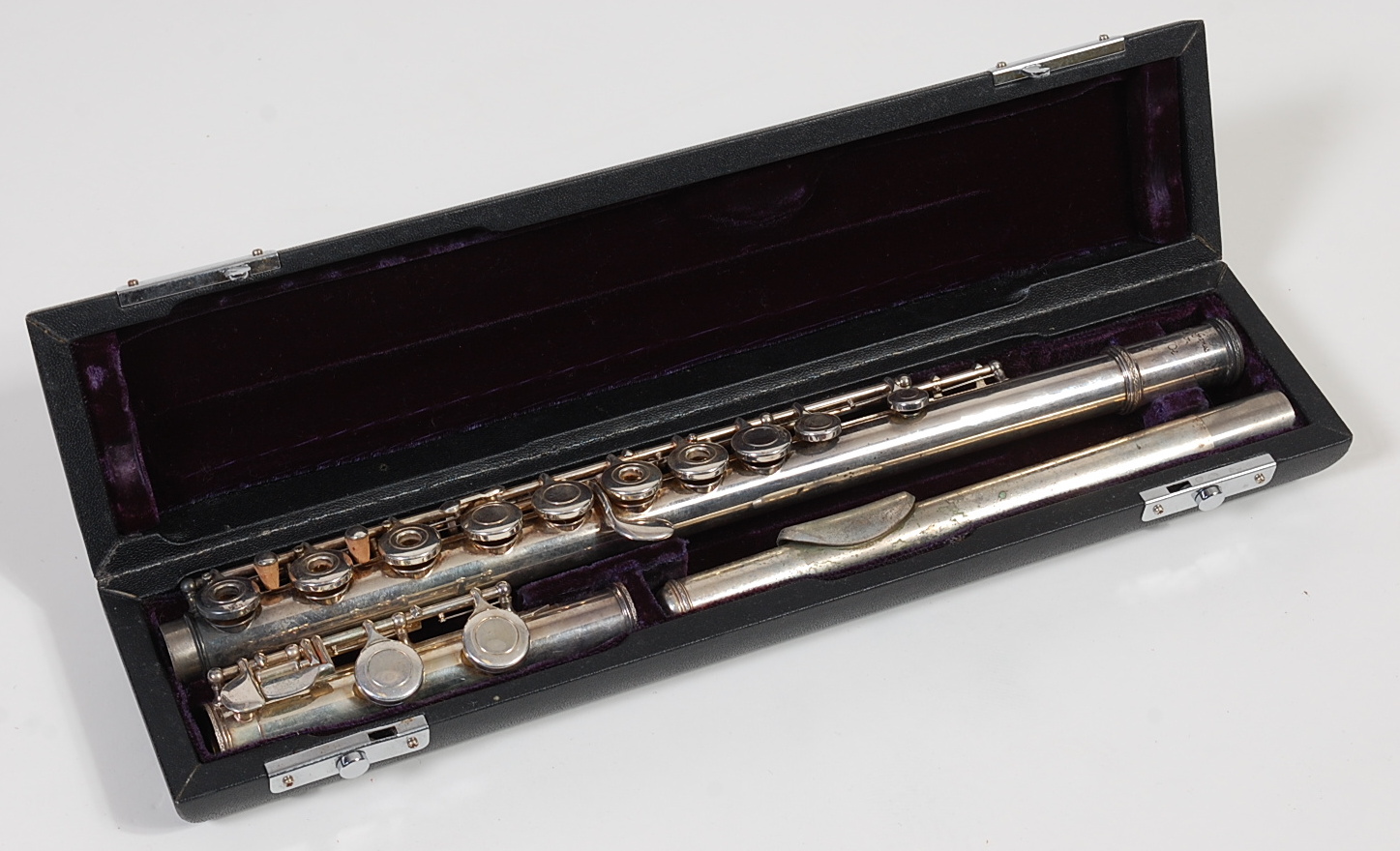 A cased silver-plated three piece flute, by Trevor J. James, T.J.