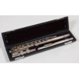 A cased silver-plated three piece flute, by Trevor J. James, T.J.