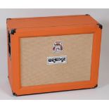 An Orange lead guitar speaker cabinet/amp, having two Vintage 30 Celestion speakers,