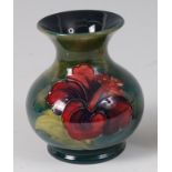 An early 20th century Moorcroft pottery miniature baluster squat vase, in the Anemone pattern,