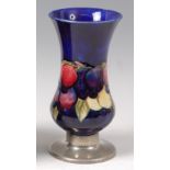 William Moorcroft for Liberty & Co - A pottery vase in the Wisteria pattern,