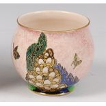 A 1930s Crown Devon lustre glazed ceramic squat vase, decorated with butterflies within a landscape,