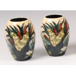 A pair of contemporary Moorcroft pottery vases, in the Lamia pattern, each of ovoid form,
