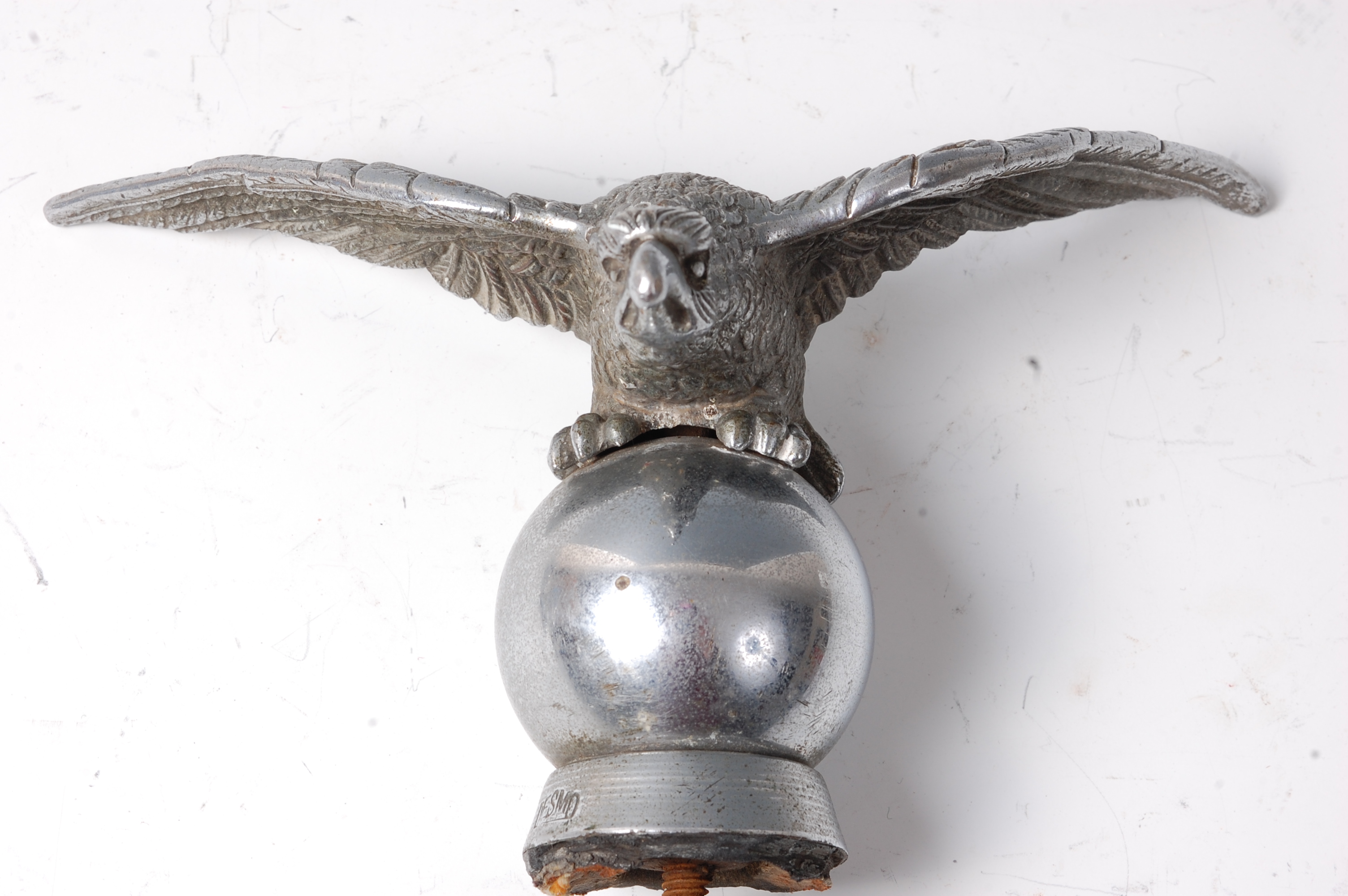 A Desmo chrome car mascot, modelled as an eagle perched on a globe, stamped 'Desmo', - Image 2 of 2