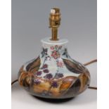 A Moorcroft Pottery table lamp, in the Bramble pattern, of lower bellied form,