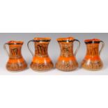 A set of four Myott & Son painted ceramic single handled jugs,