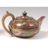 A late George III silver teapot, of squat circular form,