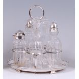 A late Victorian silver five bottle cruet stand, having centre carry handle, the whole of oval form,