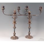 A pair of silver plated three light candelabra, in the Rococo taste, circa 1900,