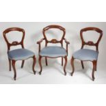 A set of twelve Victorian style mahogany balloon back dining chairs,