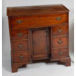A George III mahogany kneehole writing desk,