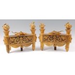 A pair of late 19th century French gilt bronze chenet, in the Louis XVI style,