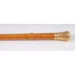 A 19th century malacca and yellow metal topped walking cane,