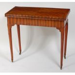 A George II laburnum veneered card table, the top having a four quarter veneer and feather banding,