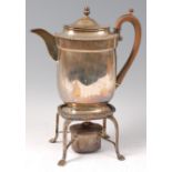 A late George III silver hot water jug, having acorn finial and fruitwood C-scroll handle,