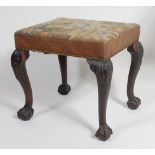 A George III mahogany dressing stool, having a woolwork stuffover seat,