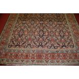 A Persian woollen blue ground carpet,