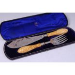 A pair of Victorian silver fish servers, the blade and fork each with pierced and etched decoration,