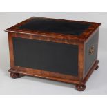 An oyster laburnum and tooled leather blanket box, having end brass carry handles and on bun feet,