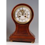 An Edwardian mahogany and inlaid balloon shaped mantel clock,