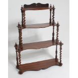 A Victorian rosewood four tier wall shelf, of small size, on spiral turned columns, h.66cm, w.