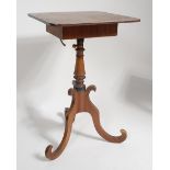 A late Georgian mahogany pedestal reading table, having hinged top with ebony stringing,