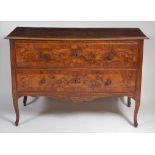 An 18th century French provincial walnut and figured walnut commode,