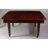 A Victorian mahogany extending dining table, the top having pull-out action,