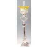 A silver plated Corinthian column pedestal oil lamp,