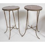 A pair of circa 1900 brass and rouge marble topped occasional tables, each of circular form,