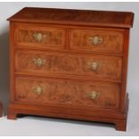 A walnut and inlaid chest, in the early 18th century style,