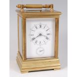 A circa 1900 French brass carriage clock, with alarm and push button hour repeat,