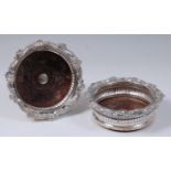 A pair of George III silver wine bottle coasters, of circular form,