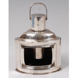 An Edwardian silver novelty table lighter in the form of a ships starboard lantern, lacking glass,