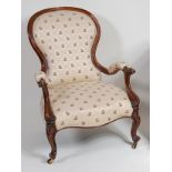 A circa 1850 walnut framed spoonback showframe open armchair,