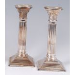 A cased pair of modern silver Corinthian column candlesticks, by Elkington & Co,