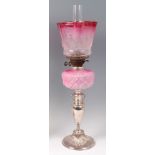 A silver plated pedestal oil lamp,