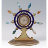 A Victorian brass and agate ships wheel barometer, the handles formed from turned and banded agate,