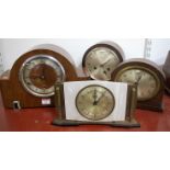 An Art Deco walnut cased mantel clock, having silvered chapter ring with Roman numerals,