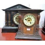 A late Victorian faux marble cased mantel clock, of architectural form,