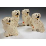 A pair of Beswick models of seated Spaniels,