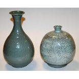 A Celadon glazed stoneware vase of onion shape having applied fruiting vine decoration, height 27cm,