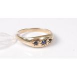 A 9ct sapphire ring, the three gypsy set sapphires,