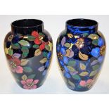 A pair of early 20th century Royal Stanley ware vases of baluster form each on a deep blue ground