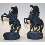 A pair of modern spelter figures of rearing horses, h.