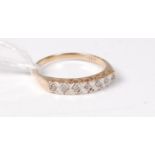 A 9ct seven stone diamond ring, the small round illusion set diamonds,