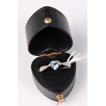 A 9ct heart shaped topaz and diamond ring, the heart shaped topaz in a three claw mount,