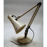 A cream painted angle poise desk lamp